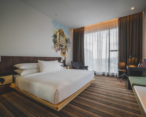 Camera vista mare del Fenici Levanzo Hotel con toni naturali e design essenziale